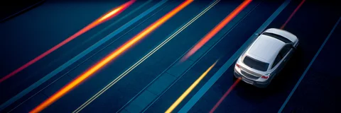 Neon architecture and vehicle light trails — view 2