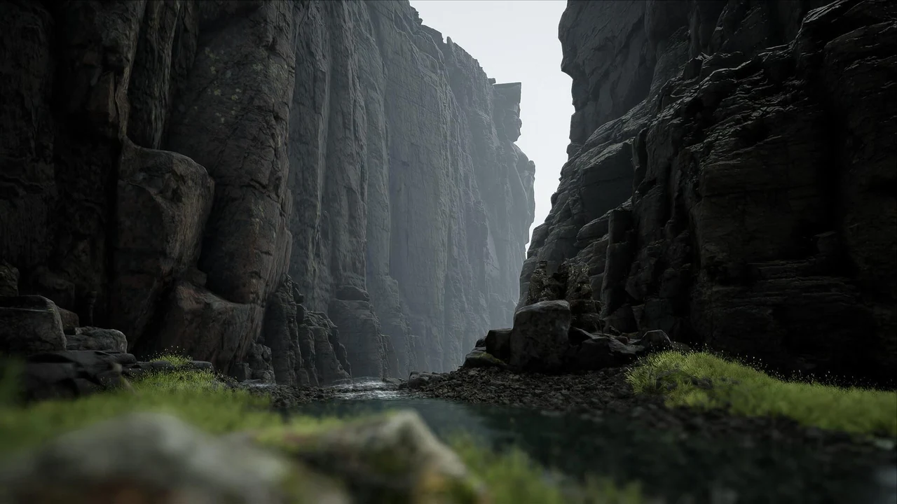 Mossy canyon framed by dark vertical rock formations