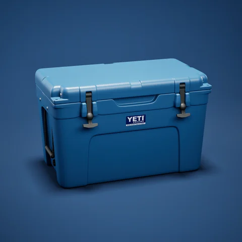 Blue hard cooler against a blue background