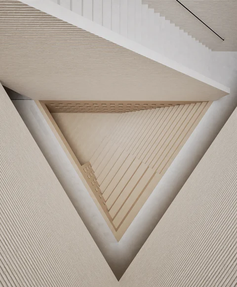 Triangular skylight above a pale timber interior