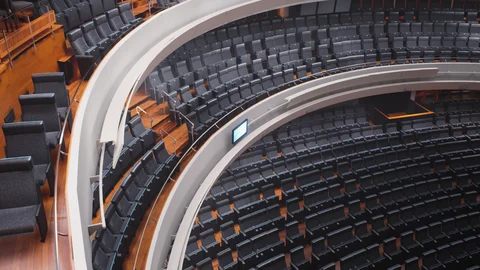 Curved auditorium balconies and rows of seats
