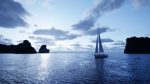 Sailboat beneath a cool evening sky