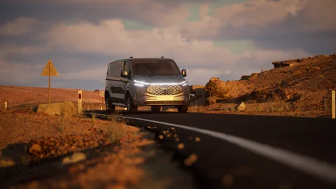 Van approaching along a rocky road