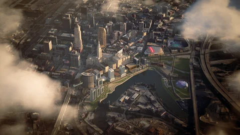 Aerial city view framed by low clouds