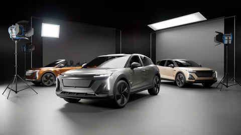 Three vehicles arranged in a lighting studio