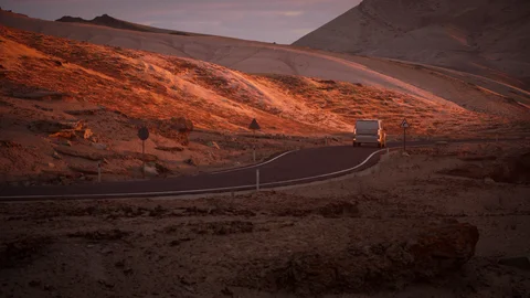 Winding road through a red-rock landscape