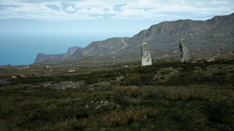 Rocky coastal landscape with standing stones