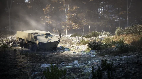 Armoured vehicle on a shaded forest track