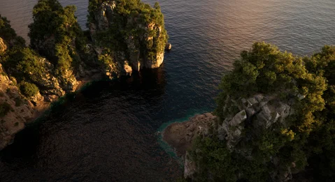 Golden light across a narrow coastal inlet