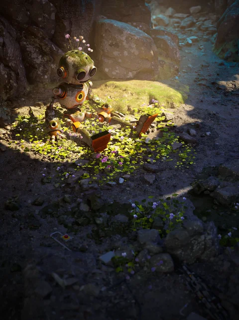 Small orange robot in a sunlit patch of vegetation