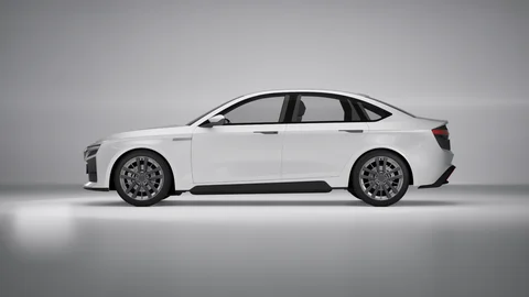 White sedan in profile against a neutral background