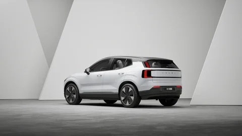 White Volvo in a geometric studio — view 1